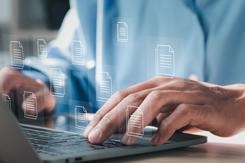 Hands over a laptop keyboard accessing open data