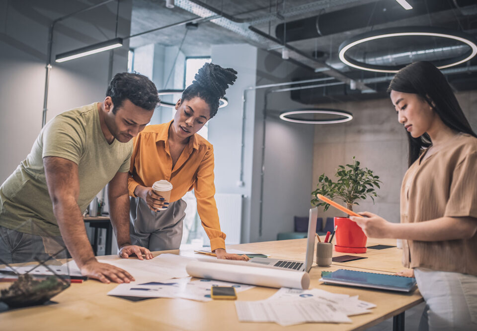 People reviewing documents and brainstorming