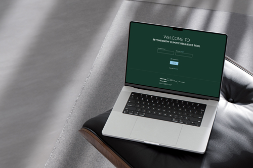 Laptop screen with Climate Resilience Tool login.
